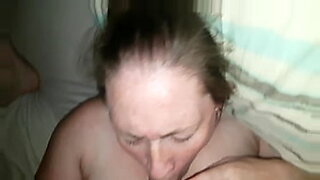 milf giving blowjob for guy getting her tits and pussy rubbed on the bed in the hotel